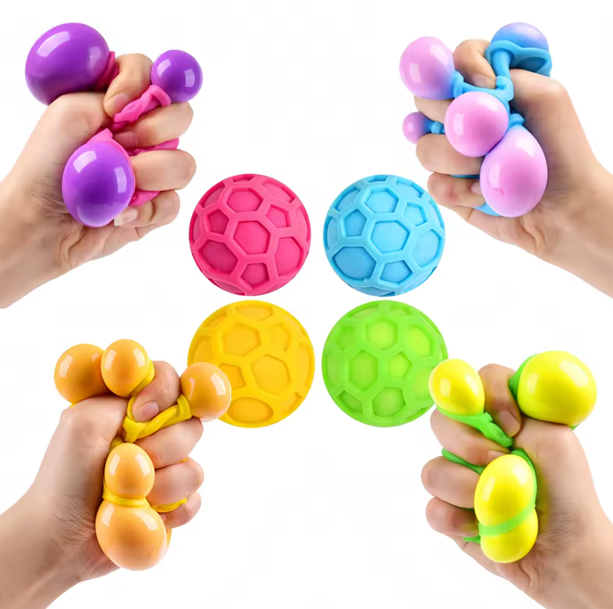 NeeDoh Atomic sensory fidget squeeze toy showing multiple groovy globs revealed on squeeze in blue yellow and pink two-tone colors