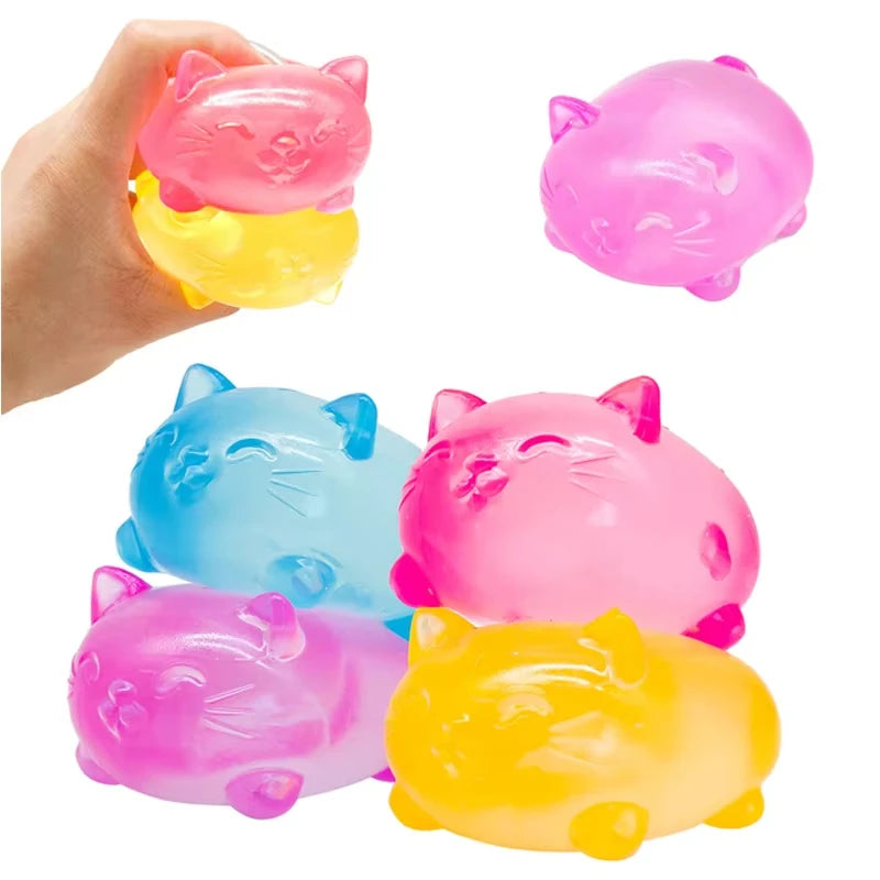 Hand squeezing NeeDoh Cat sensory fidget toy showing soft tactile stress relief squish