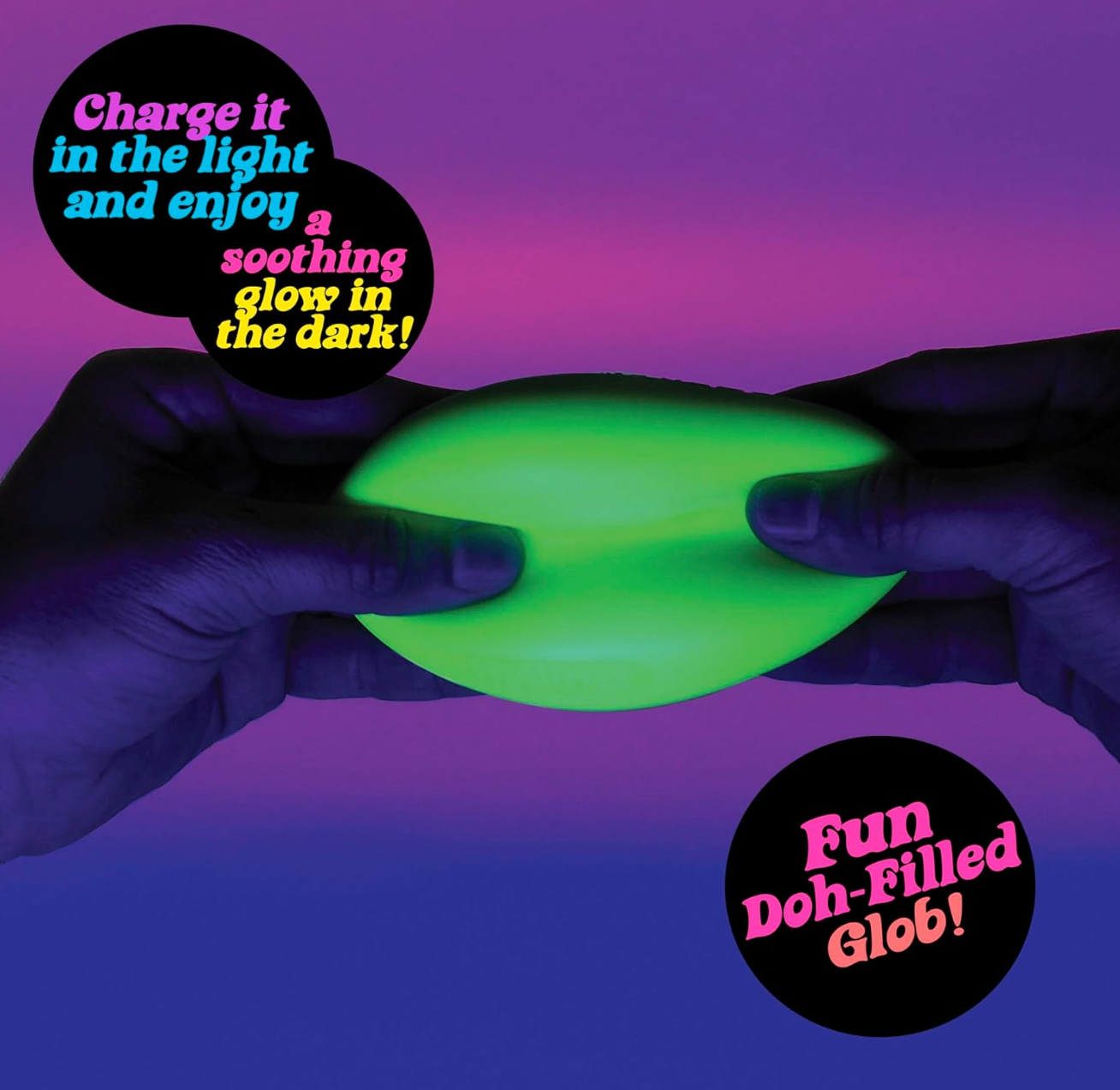 NeeDoh Glow in the Dark Groovy Glob stress ball emitting green glow in a dark room